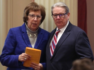 Sen. Lois Wolk, left, D-Davis and Sen. Bill Monning, D-Carmel, who have coauthored right-to-die legislation, stand together during the Senate session at the Capitol in Sacramento, Calif., Tuesday, Jan. 20, 2015. The measure was inspired by the case of Brittany Maynard, a 29-year-old San Francisco Bay Area woman who moved to Oregon where she could legally end her life. The lawmakers will introduce the legislation, with members of Maynard's family, at a Capitol news conference, Wednesday, Jan. 21. (AP Photo/Rich Pedroncelli)