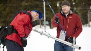 MEYERS, CALIFORNIA - JANUARY 29: California Department of Water Resources (DWR) Chief of Cooperative Snow Survey Frank Gehrke (L) weighs a snow sample while assisted by Kasey Schimke, DWR Assistant Director for Legislative Affairs January 29, 2010 near Meyers, California. The survey measured an average depth of 67.8 inches, and that Sierra-wide the snowpack is 117% of normal. Gehrke stated that much more would be needed to refill reservoirs and relieve California's drought. (Photo by Max Whittaker/Getty Images)